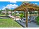 Wooden gazebo with picnic table and access to the dock at 3650 Pepper Ln, New Smyrna Beach, FL 32168
