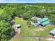 Aerial view of property with home and large barn at 3650 Pepper Ln, New Smyrna Beach, FL 32168