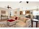Relaxing living room featuring sectional sofa and hardwood floors at 3650 Pepper Ln, New Smyrna Beach, FL 32168