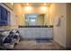 Double vanity bathroom with granite countertop at 1726 Red Rock Rd, New Smyrna Beach, FL 32168