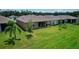Backyard view of house with patio and landscaping at 1726 Red Rock Rd, New Smyrna Beach, FL 32168