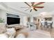 Open living room with hardwood floors and views at 4650 Links Village Dr # D-501, Ponce Inlet, FL 32127