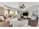 Comfortable living room with large TV and access to balcony at 4650 Links Village Dr # D-501, Ponce Inlet, FL 32127