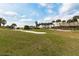 Expansive grassy area with palm trees near ocean at 4650 Links Village Dr # D-501, Ponce Inlet, FL 32127