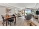 Spacious living room with hardwood floors and balcony access at 4650 Links Village Dr # D-501, Ponce Inlet, FL 32127