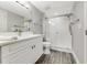 Updated bathroom with walk-in shower and modern vanity at 4650 Links Village Dr # D-501, Ponce Inlet, FL 32127
