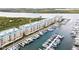 Aerial view of waterfront community with boat slips and buildings at 4650 Links Village Dr # D-501, Ponce Inlet, FL 32127