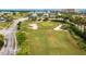 Landscaped putting green for residents' enjoyment at 4650 Links Village Dr # D-501, Ponce Inlet, FL 32127