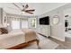 Bright bedroom with king bed and large dresser at 4650 Links Village Dr # D-501, Ponce Inlet, FL 32127