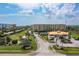 Attractive community entrance with landscaping and parking at 4650 Links Village Dr # D-501, Ponce Inlet, FL 32127