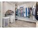 Large walk-in closet with ample hanging space and shelving at 4650 Links Village Dr # D-501, Ponce Inlet, FL 32127