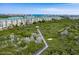 Nature trail boardwalk through lush vegetation at 4650 Links Village Dr # D-501, Ponce Inlet, FL 32127