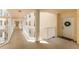 Building hallway with columns and white railings at 4650 Links Village Dr # D-501, Ponce Inlet, FL 32127