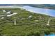 Aerial view of lush conservation area with walking paths at 4650 Links Village Dr # D-501, Ponce Inlet, FL 32127