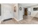 Light and airy entryway with laminate wood floors and barn door leading to kitchen at 4650 Links Village Dr # D-501, Ponce Inlet, FL 32127