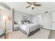 Grey walls, king-size bed, and ensuite bathroom at 4650 Links Village Dr # D-501, Ponce Inlet, FL 32127