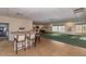 Spacious community room with bar and seating area at 4650 Links Village Dr # D-501, Ponce Inlet, FL 32127