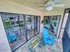 Relaxing lanai with patio furniture and view of the community pool at 406 Bouchelle Dr # 206, New Smyrna Beach, FL 32169