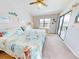 Spacious bedroom with king-size bed and access to a balcony at 406 Bouchelle Dr # 206, New Smyrna Beach, FL 32169