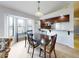 Dining area with table and chairs, adjacent to kitchen at 406 Bouchelle Dr # 206, New Smyrna Beach, FL 32169