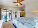 King bedroom with private bathroom and balcony access at 406 Bouchelle Dr # 206, New Smyrna Beach, FL 32169