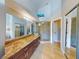 Elegant bathroom with a walk-in shower and granite vanity at 406 Bouchelle Dr # 206, New Smyrna Beach, FL 32169
