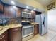 Modern kitchen with stainless steel appliances and granite countertops at 406 Bouchelle Dr # 206, New Smyrna Beach, FL 32169