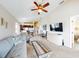 Living room with comfy seating and access to balcony at 406 Bouchelle Dr # 206, New Smyrna Beach, FL 32169
