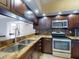 Kitchen boasts stainless steel appliances and granite counters at 406 Bouchelle Dr # 206, New Smyrna Beach, FL 32169