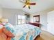 Bright bedroom with a queen-size bed and large window at 406 Bouchelle Dr # 206, New Smyrna Beach, FL 32169