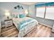 Guest bedroom with a queen bed and ocean decor at 4175 S Atlantic Ave # 4120, New Smyrna Beach, FL 32169