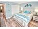Comfortable bedroom with a king-size bed and coastal decor at 4175 S Atlantic Ave # 4120, New Smyrna Beach, FL 32169