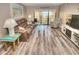 Living Room with ocean view, comfortable seating, and hardwood floors at 4175 S Atlantic Ave # 4120, New Smyrna Beach, FL 32169