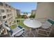 Balcony with ocean view and small table with chairs at 4175 S Atlantic Ave # 4120, New Smyrna Beach, FL 32169