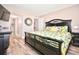 King-size bed, large TV, and en-suite bathroom at 4175 S Atlantic Ave # 4120, New Smyrna Beach, FL 32169