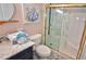 Updated bathroom with marble vanity and walk-in shower at 4175 S Atlantic Ave # 4120, New Smyrna Beach, FL 32169