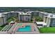 Aerial view of Castle Reef Condominiums, highlighting the pool and grounds at 4175 S Atlantic Ave # 4120, New Smyrna Beach, FL 32169