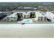 Aerial view of beachfront condo complex with pool and surrounding area at 4175 S Atlantic Ave # 4120, New Smyrna Beach, FL 32169
