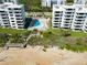 Aerial view of beachfront property with pool and beach access at 5301 S Atlantic Ave # 52, New Smyrna Beach, FL 32169