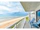 Relaxing balcony with ocean view and comfortable seating at 5301 S Atlantic Ave # 52, New Smyrna Beach, FL 32169