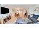Open living room with stylish rug and ocean view at 5301 S Atlantic Ave # 52, New Smyrna Beach, FL 32169