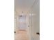 Long hallway with tile floor and several doors at 5301 S Atlantic Ave # 52, New Smyrna Beach, FL 32169