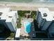 Aerial view of oceanfront building with pool and beach access at 5301 S Atlantic Ave # 52, New Smyrna Beach, FL 32169
