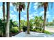 Outdoor patio area with grill and tropical landscaping at 5301 S Atlantic Ave # 52, New Smyrna Beach, FL 32169