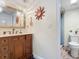 Bathroom with vanity, shower, and decorative accents at 2100 N Peninsula Ave # 1150, New Smyrna Beach, FL 32169