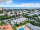 Aerial view showing condo community near the beach, with pool and parking at 2100 N Peninsula Ave # 1150, New Smyrna Beach, FL 32169