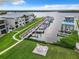Aerial view of waterfront property with private boat slips and seating area at 2100 N Peninsula Ave # 1150, New Smyrna Beach, FL 32169