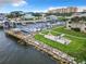Aerial view of waterfront community with private docks and seating area at 2100 N Peninsula Ave # 1150, New Smyrna Beach, FL 32169
