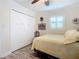 Cozy bedroom with a double bed, built in closet, and window shutters at 2100 N Peninsula Ave # 1150, New Smyrna Beach, FL 32169