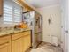 Kitchen with stainless steel refrigerator and granite countertops at 2100 N Peninsula Ave # 1150, New Smyrna Beach, FL 32169